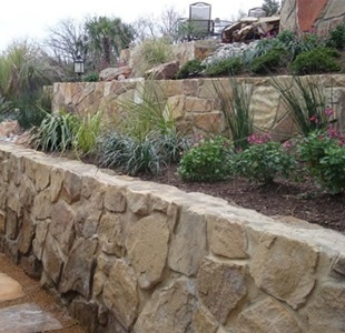 rock retaining wall set in cement